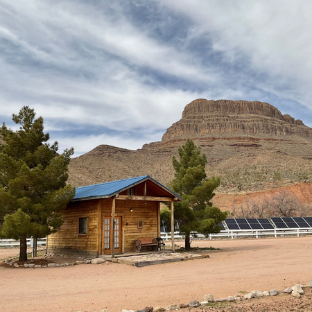 Experience the history of the wild west with an overnight stay in a large rustic Grand Canyon Western Ranch Cabin!